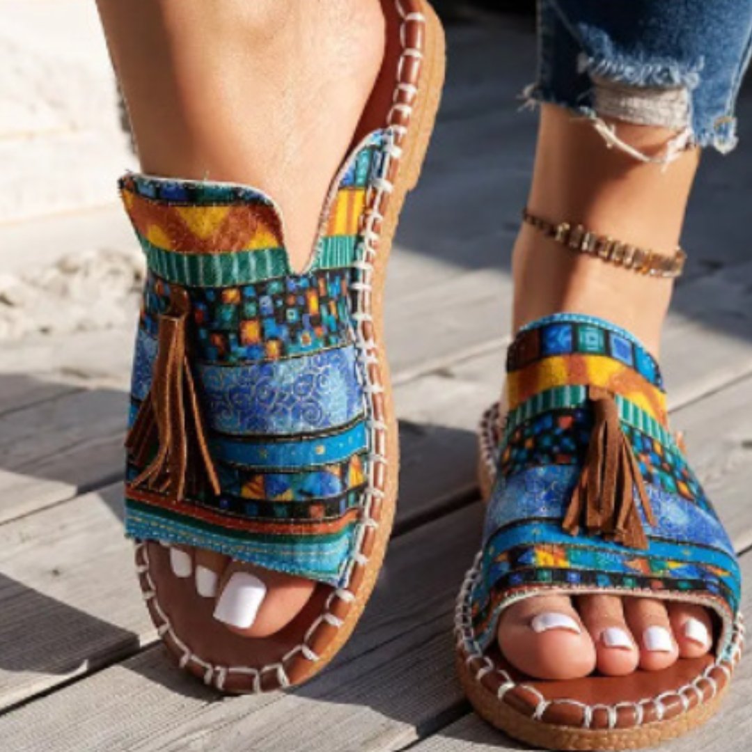 Damen Pantoletten flach Boho mit Quasten – Slip-On für den Sommer | Alma
